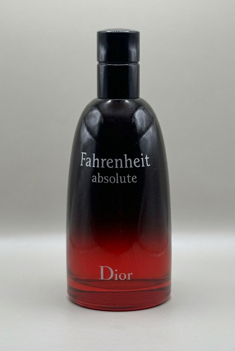 Dior Fahrenheit Absolute bottle with black-to-red gradient glass on a soft grey background